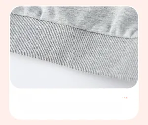 Close-up of the ribbed elastic hem on a gray knitted cotton sweatshirt for boys