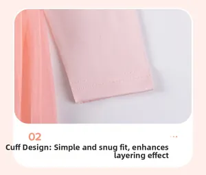 Détail d'une manche en tricot rose avec tulle doux et couture double précise