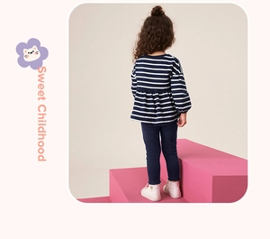 Detail view of girls navy striped long sleeve top with ruffles and matching blue pants