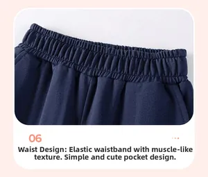Detail view of boys navy blue sweatshirt waistband with elastic cuff and side pocket design