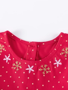 Red cotton girls' dress with polka dots and detailed festive floral embroidery on neckline