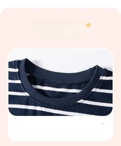 Detail of ribbed crew neck on navy and white striped cotton kids shirt with fine stitching