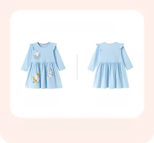 Detail view of baby girl blue long sleeve dress with white polka dots and bunny print