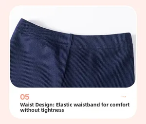 Close-up of elastic waistband on navy blue ribbed knit trousers for toddler girls