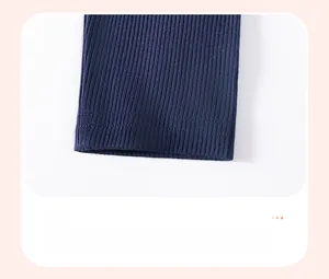 Detail view of navy blue ribbed knit pants cuff with reinforced double-needle stitching