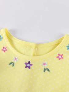 Robe jaune citron à pois pour fille avec broderies florales colorées sur l'encolure