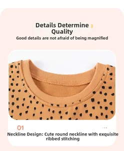 Detail of caramel brown polka dot sweatshirt neckline with fine stitching and ribbed collar