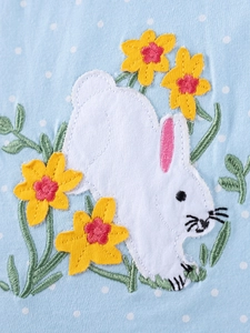 Light blue polka dot girls' dress featuring embroidered rabbit and spring yellow flowers