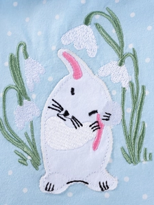 Blue polka dot girls dress featuring cute rabbit and flower embroidery detail