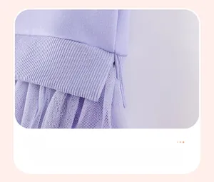 Detailed macro view of purple knitted rib hem with side slit and matching tulle overlay