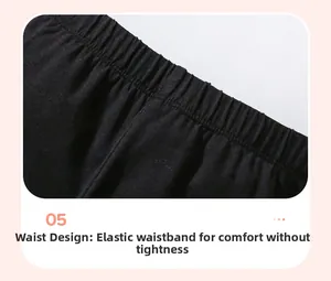 Detail shot of the comfortable elastic waistband on these black cotton girls' trousers