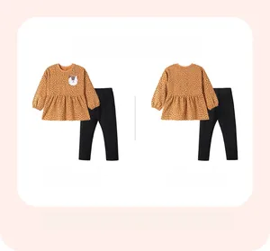 Detailed front and back view of girls' orange polka dot sweatshirt with cat applique