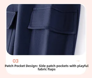 Detail of navy cargo pants showing textured fabric and a functional flap pocket for boys