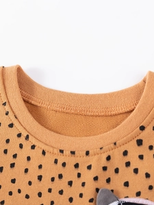 Girl's brown polka dot sweatshirt with premium ribbed crew neck and soft cotton texture