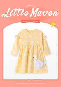 Detail of yellow long sleeve cotton girl dress with white polka dots and swan pocket