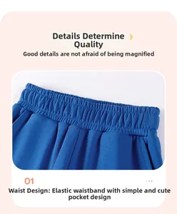 Detail of blue boys cargo trousers featuring a comfortable elastic waistband and side pockets