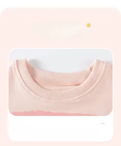 Close-up of pink cotton sweatshirt ribbed neckline and high-quality flatlock stitching