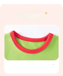 Detail of green cotton T-shirt featuring a red contrast ribbed crew neck and durable stitching
