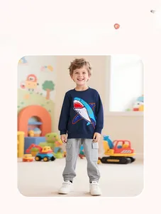 Close-up of navy boy's sweatshirt with shark applique and grey cargo sweatpants set