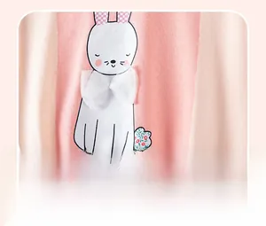 Detail of pink cotton sweatshirt featuring a cartoon rabbit with a 3D mesh bow decoration