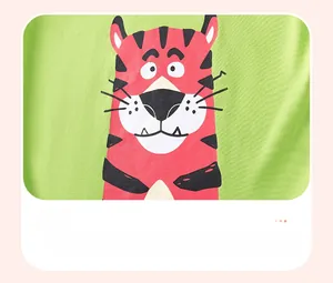 Close-up of cute tiger graphic print on green cotton boy's long sleeve t-shirt