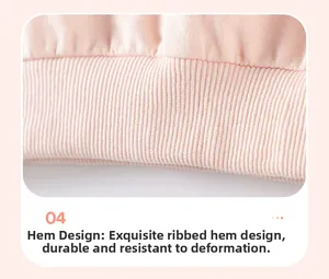 Detail of pink knit sweatshirt ribbed hem with durable elastic stitching finish