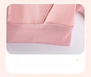 Close-up of pink cotton sweatshirt ribbed hem and high-quality knitting texture details