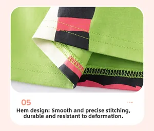 Detail view of cotton boy's t-shirt hem with contrast print and double-needle stitching