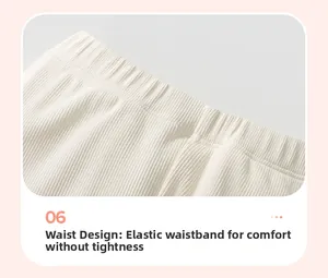 Detail of white ribbed knit elastic waistband on girls' long-sleeve cartoon sweatshirt