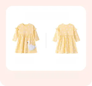 Front and back view of a yellow polka dot dress with white swan applique detail