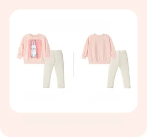 Detail view of pink long sleeve sweatshirt with white rabbit print and ribbed pants
