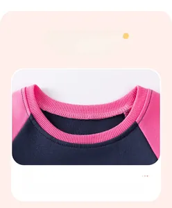 Detail of navy and pink ribbed crewneck collar on high-quality cotton kids sweatshirt