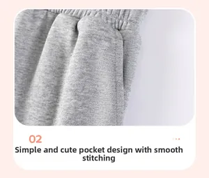 Close-up of side pocket design on grey cotton knit pants with smooth stitching detail
