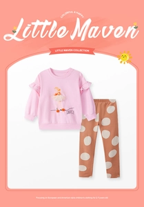 Detail of girls' long-sleeve pink ballet sweatshirt with ruffles and polka dot pants