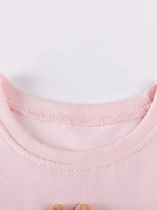 T-shirt rose en coton pour filles avec col rond côtelé et finitions à double couture
