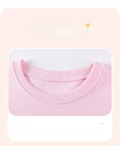 Close-up of pink knit sweatshirt ribbed neckline with high-quality stitching detail