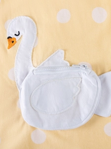 Yellow cotton girl's dress with white polka dots and a swan zipper pocket detail