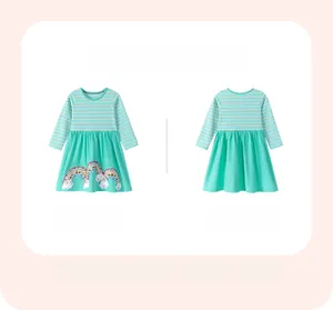 Detail of girls striped dress with mint green skirt and sequin rainbow cloud embroidery