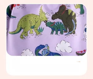 Detailed pattern of cute cartoon dinosaurs on purple cotton fabric for girls' dresses