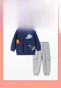 Detail of space-themed embroidery featuring UFO and rocket on navy cotton sweatshirt