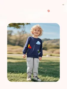 Close-up of boys space theme sweatshirt with planet and rocket embroidery details