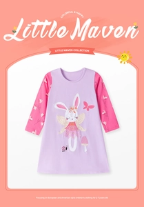 Detail of baby girl cotton dress showing a cute rabbit fairy embroidery and floral patches