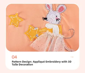 Dettaglio ricamo topo bianco e tulle a rete 3D sull'abito in cotone arancione per bimba