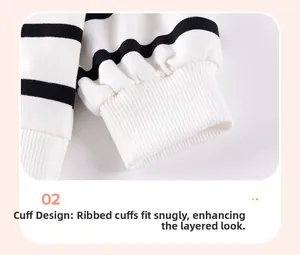 Close-up of ribbed cuffs on striped cotton long sleeve sweatshirt for young girls