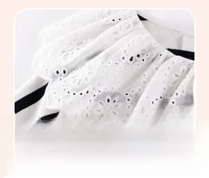 Detail of baby girl stripe top featuring elegant white lace embroidery ruffled collar