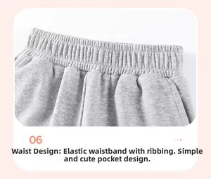 Detail view of boys gray cotton sweatpants featuring elastic waistband and side pockets