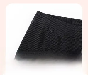 Macro detail of black ribbed knit fabric with double-needle stitching for toddler set