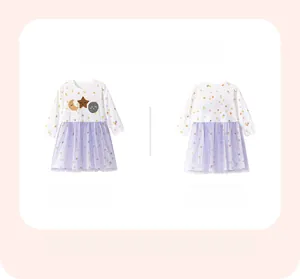 Detail showing girls long-sleeve dress with moon embroidery and purple mesh skirt