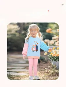 Detail view of cotton sweatshirt with beetle pattern and pink pants for girls