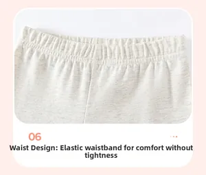 Dettaglio della vita elastica di un pantalone in maglia di cotone grigio per bambina
